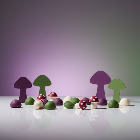 Amanita mushroom gummies with purple and green brand colors