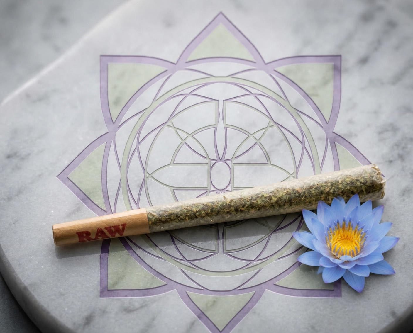 Exotics House Pre-Roll 1.5g blue lotus blend in a RAW cone beside a blue lotus flower on the Exotics emblem
